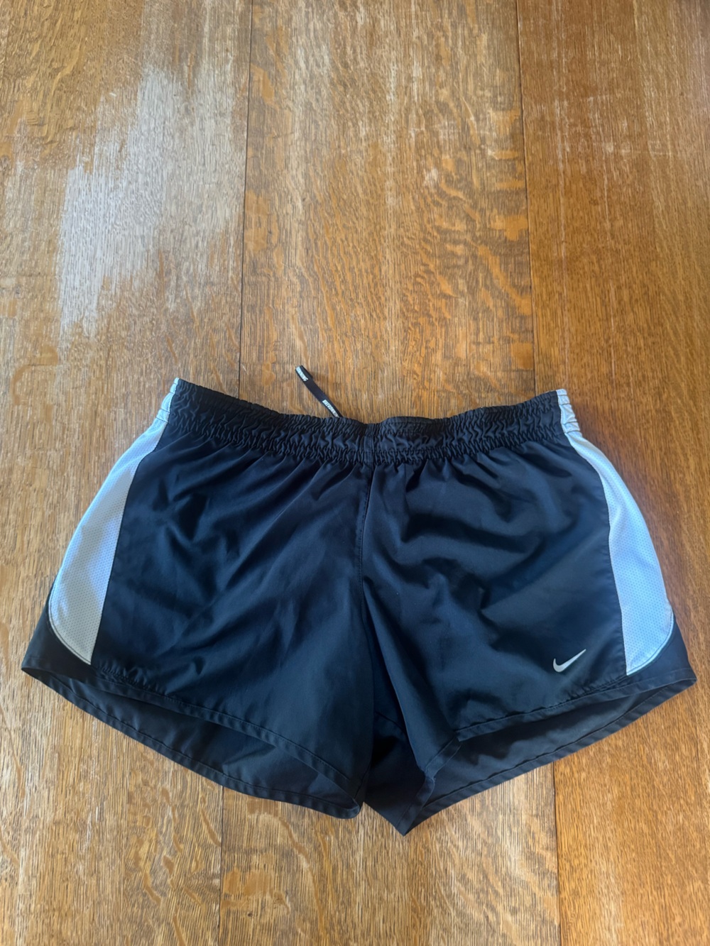 Nike Gray Athletic Shorts with White Swoosh